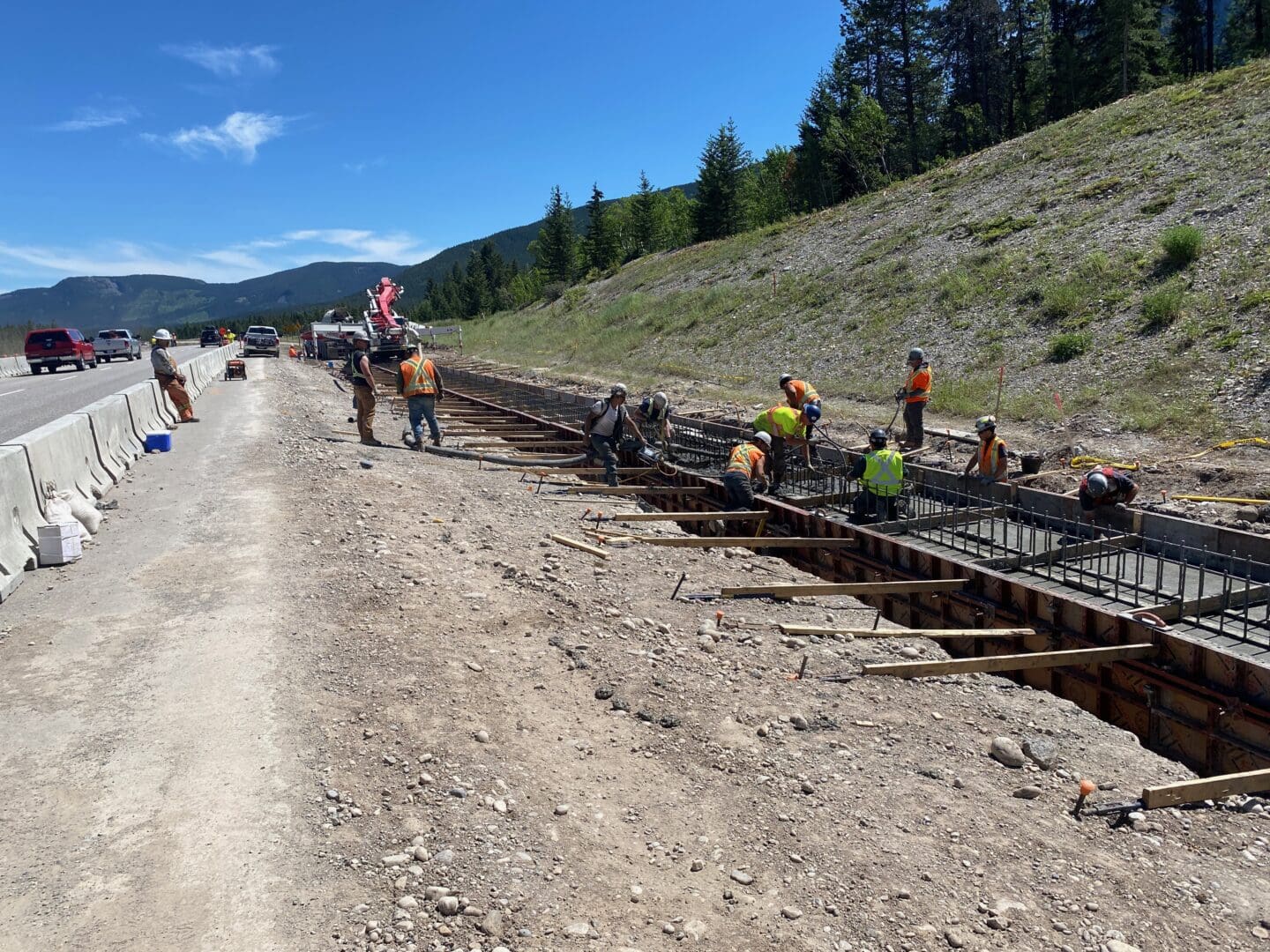 Crews pour concrete for the Bow Valley Gap wildlife overpass near Canmore